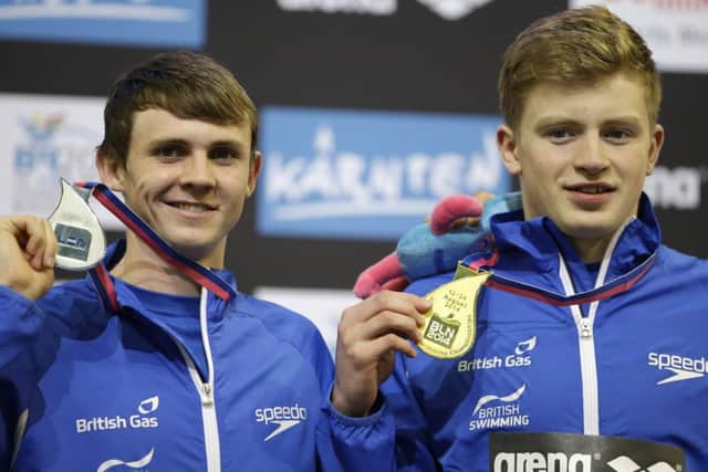Scotlands Ross Murdoch, left, and Adam Peaty show off their medals in Berlin last night. Picture:AP