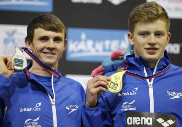 Scotlands Ross Murdoch, left, and Adam Peaty show off their medals in Berlin last night. Picture:AP