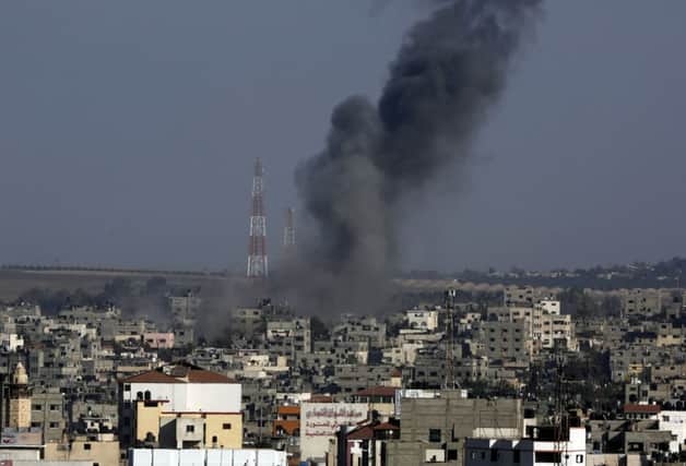 Smoke rises after Israeli air strikes hit Gaza City in response to rockets fired at Beersheba in southern Israel. Picture: Adel Hana/AP