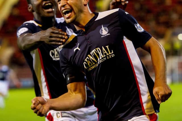 Tom Taiwo celebrates his second goal of the night as his side advanced to the last eight of the Petrofac Training Cup. Picture: SNS
