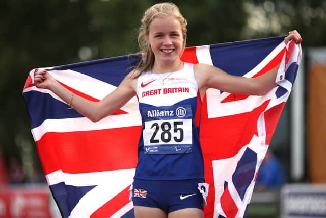 Maria Lyle, 14, celebrates her gold medal in the T35 100m at the  IPC Athletics European Championships in Swansea. Picture: Getty Images