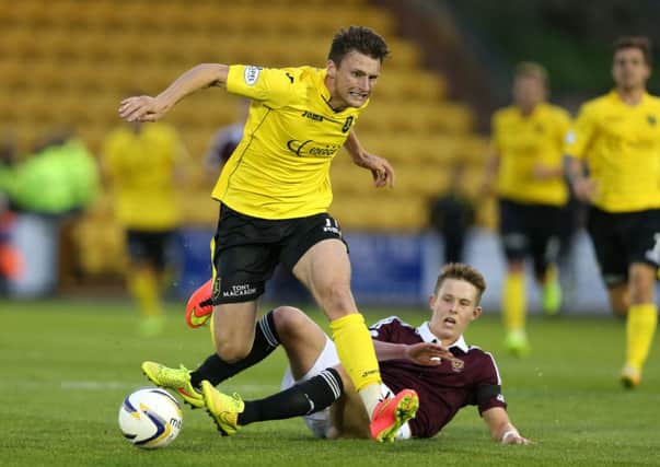 Michael McKenna of Livingston is tackled by Hearts' Angus Beith. Picture: Getty Images