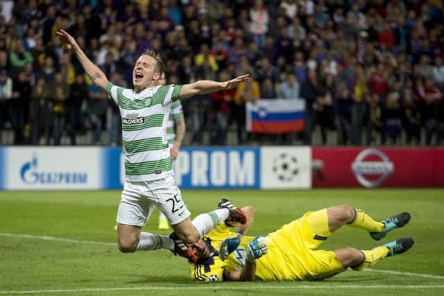 Stefan Johansen goes to ground under the challenge from Maribor keeper Jasmin Handanovic. Picture: SNS