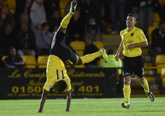 Livingstons Myles Hippolyte celebrates in spectacular style after putting his side 30 up. Picture: Gary Hutchison/SNS