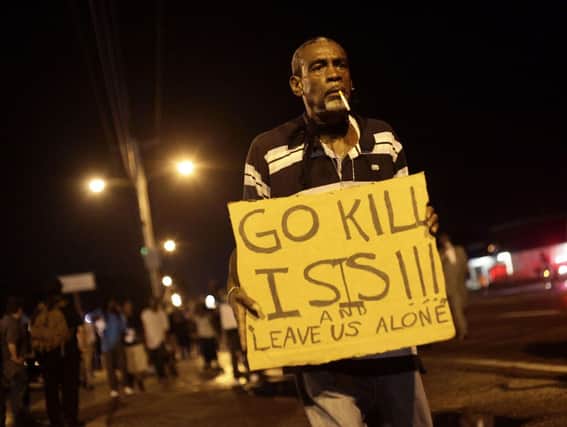 A demonstrator protests the shooting death of Michael Brown. Picture: Getty
