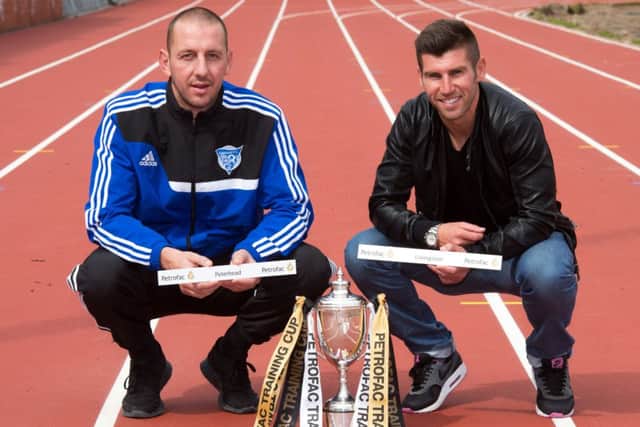 Peterhead's Graeme Smith (left) and Livingston's Mark Burchil. Picture: SNS