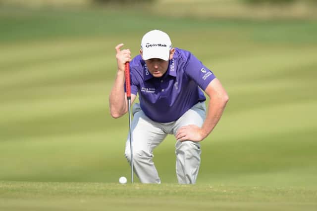 Stephen Gallacher lines up his putt on the 11th green in the first round of the Czech Masters. Picture: Getty