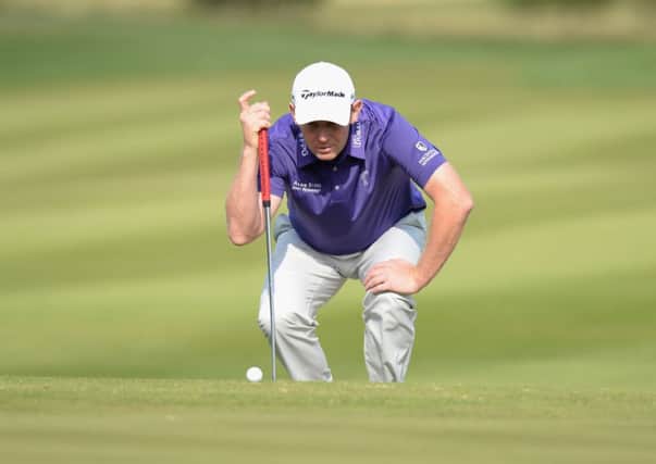 Stephen Gallacher lines up his putt on the 11th green in  the first round of the Czech Masters. Picture: Getty
