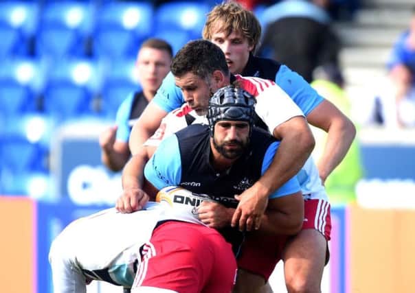 Harlequins' Joe Gray (bottom) and Nick Easter (2nd top) challenge Glasgow Warriors' Josh Strauss. Picture: SNS