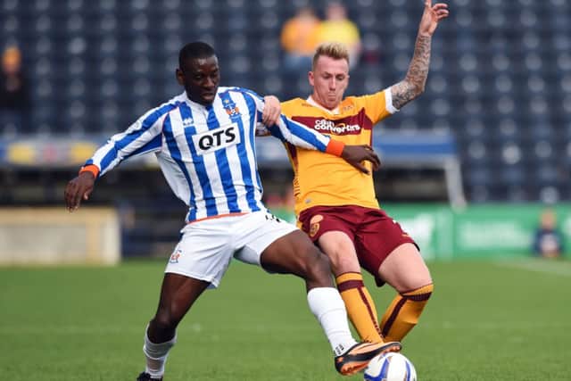 Kilmarnock's Tope Obadeyi (left) challenges Motherwell's Craig Reid. Picture: SNS