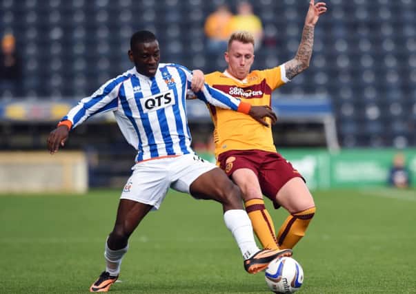Kilmarnock's Tope Obadeyi (left) challenges Motherwell's Craig Reid. Picture: SNS