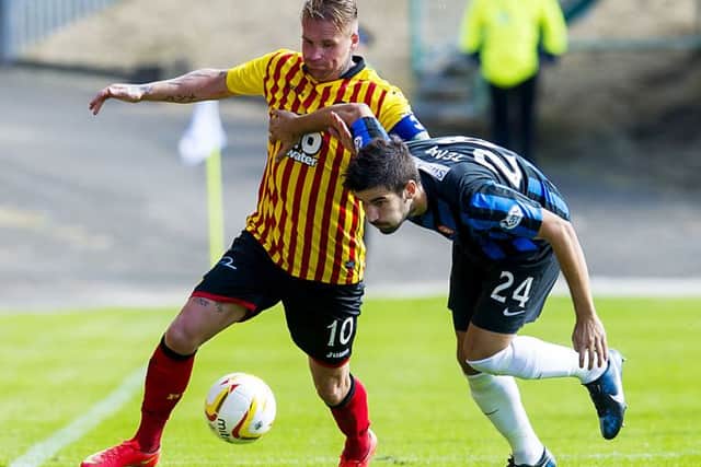 Partick Thistle star Ryan Stevenson grapples for the ball with Jesus Garcia Tena (right). Picture: SNS