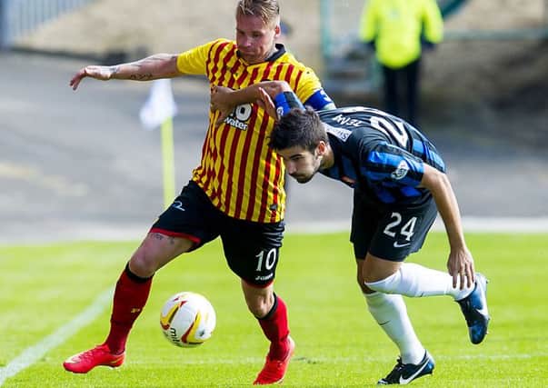Partick Thistle star Ryan Stevenson grapples for the ball with Jesus Garcia Tena (right). Picture: SNS