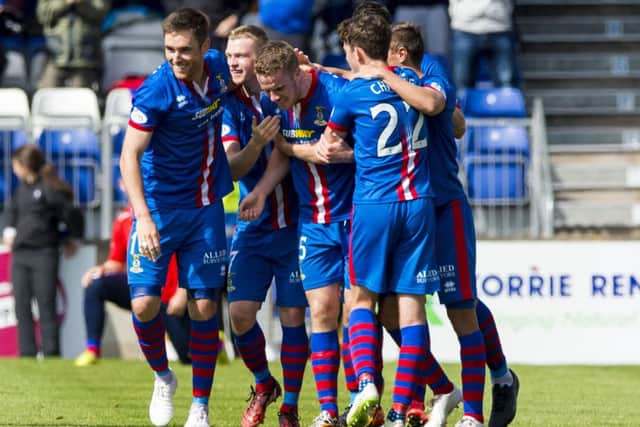 The Inverness players celebrate after an own goal by Celtic teenager Eoghan OConnell. Picture: SNS