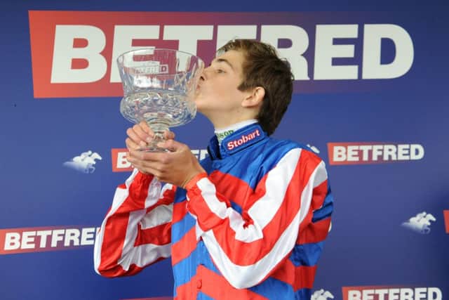 Louis Steward celebrates with the trophy after winning the Betfred Ebor on Mutual Regard at York. Picture: PA