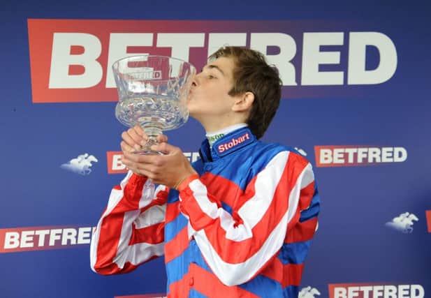 Louis Steward celebrates with the trophy after winning the Betfred Ebor on Mutual Regard at York. Picture: PA