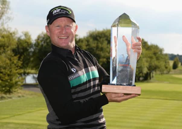 Jamie Donaldson poses with the trophy after claiming a two-stroke victory in Prague. Picture: Getty