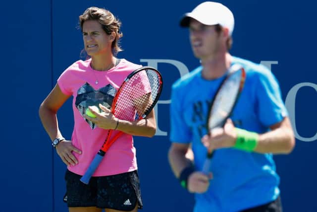 Andy Murray is watched by coach Amelie Mauresmo during practice for the US Open. Picture: Getty