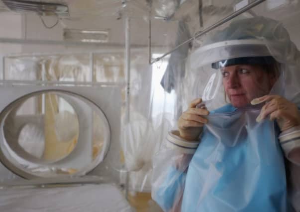 A nurse demonstrates the high-level isolation apparatus at the Royal Free Hospital. Picture: Getty