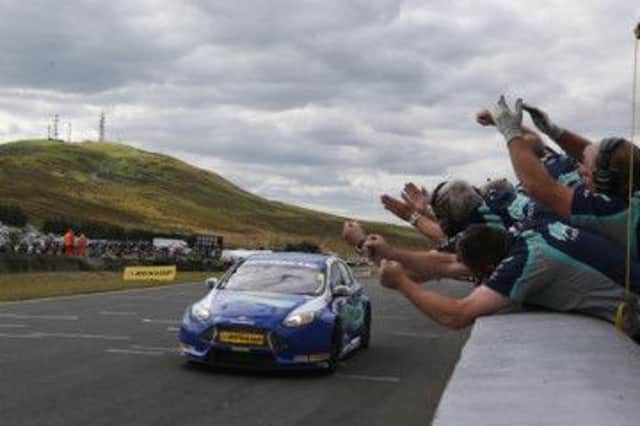 Mat Jackson speeds across the line to claim victory for the Ford team in the second race at Knockhill