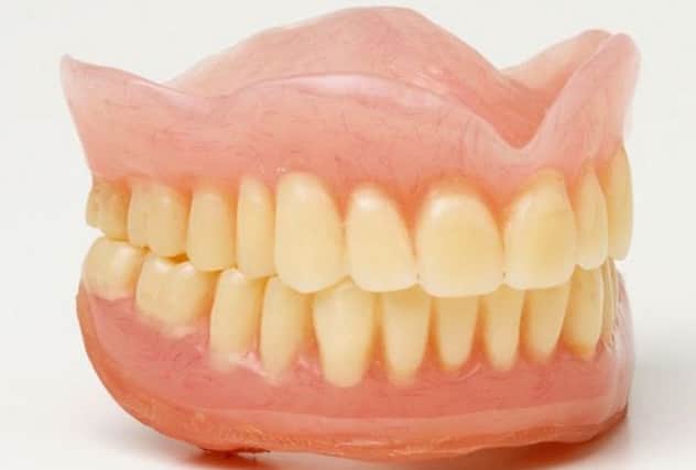 The woman's false teeth became embedded in the police officer's fingers. Picture: Getty