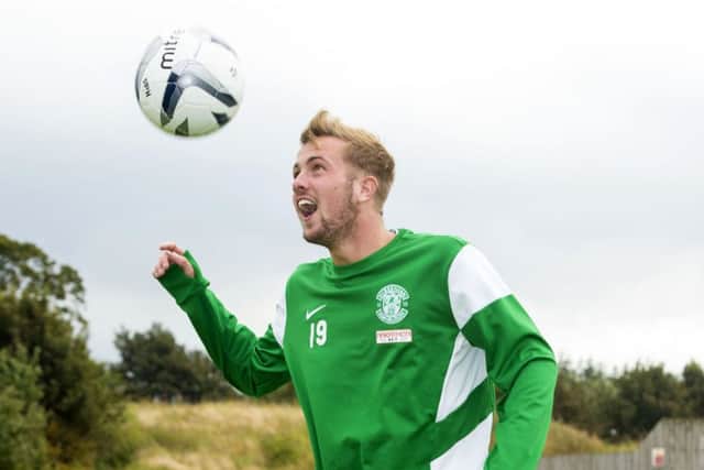 Danny Handling was all smiles yesterday after signing a new four-year deal at Easter Road. Picture: SNS