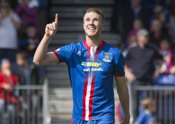 Marley Watkins celebrates the opening goal during Inverness' win over Celtic. Picture: PA