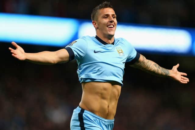 Manchester City striker Stevan Jovetic celebrates scoring his and his sides second goal against Liverpool. Picture: Getty