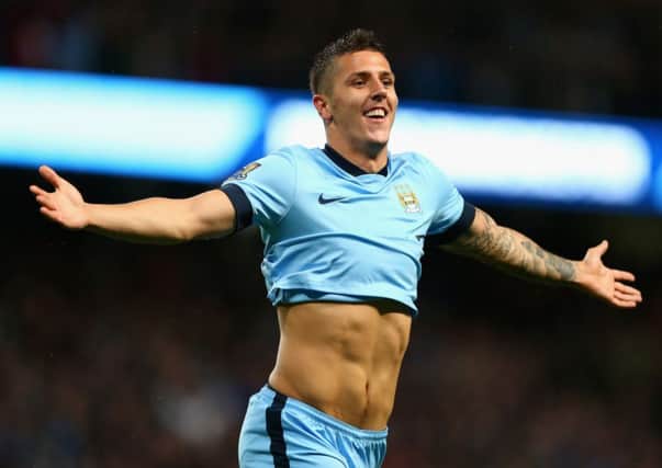 Manchester City striker Stevan Jovetic celebrates scoring his and his sides second goal against Liverpool. Picture: Getty