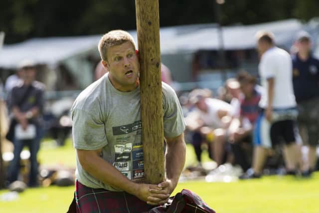 Scott Rider from England tossing the caber. He won the World Championship. Picture: Robert Perry