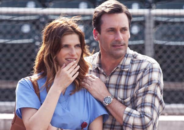 Jon Hamm as JB Bernstein and Lake Bell as Brenda, JB's neighbor and friend watch the boys pitch at USC. Picture: Ron Phillips/Disney