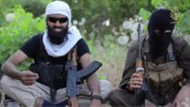 IS recruit Abdul Raqib Iman from Aberdeen (left) fighting Jihad on Iraqi video. Picture: Youtube