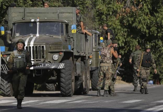 Ukrainian soldiers arrive in the village of Bezimenne. Picture: AP