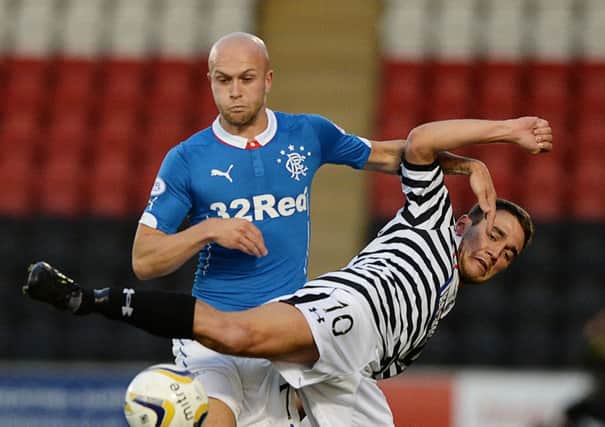 Rangers' Nicky Law battles it out with Shaun Fraser (right). Picture: SNS