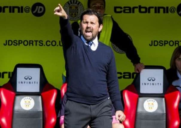 Dundee manager Paul Hartley gives instruction from the technical area. Picture: SNS