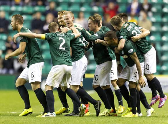 Sam Stanton (3rd left) is congratulated on his late winner. Picture: SNS