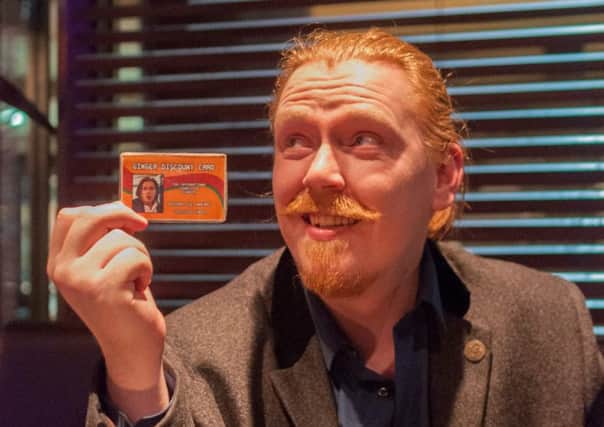 Richard Macrae, from Aberdeen, using his 'Ginger discount Card' in a bar. Picture: hemedia