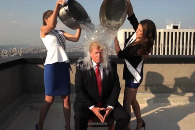 Donald Trump is covered with ice by Miss Universe and Miss USA. Picture: Screengrab