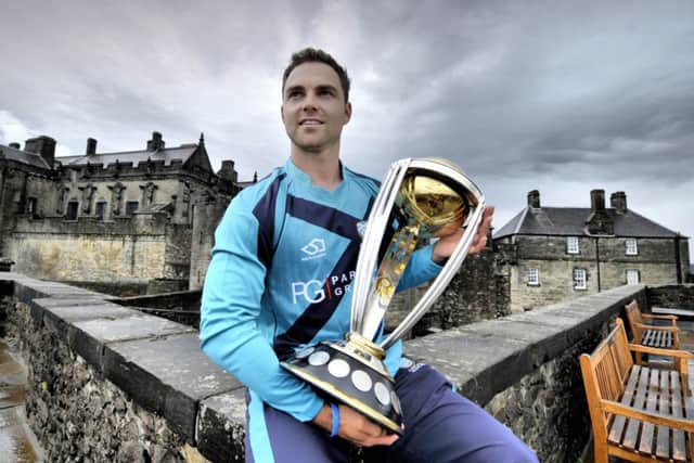 Scotland player Preston Mommsen with the ICC Cricket World Cup on the ramparts of Stirling Castle yesterday. Picture: Donald MacLeod