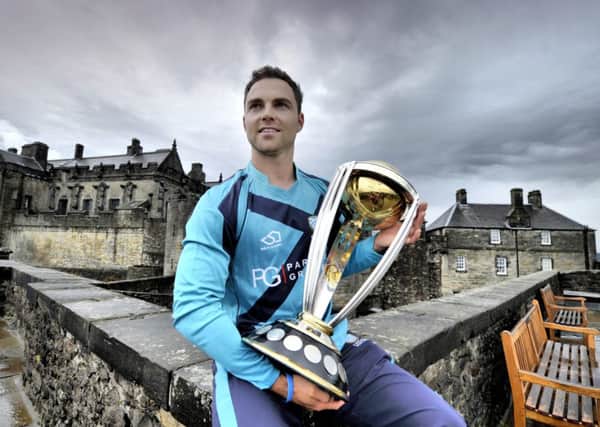 Scotland player Preston Mommsen with the ICC Cricket World Cup on the ramparts of Stirling Castle yesterday. Picture: Donald MacLeod