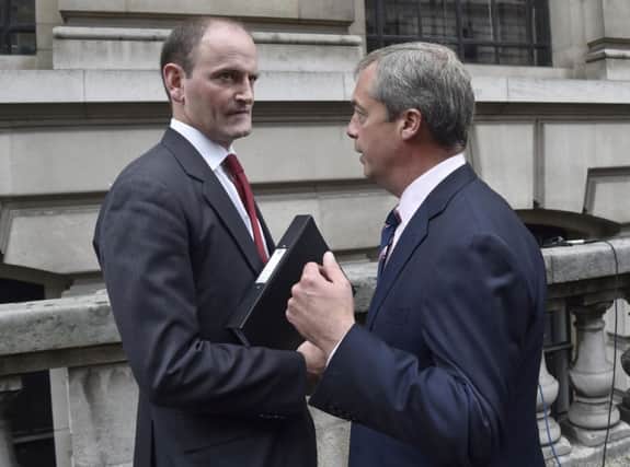 Tory defector Douglas Carswell with Ukip leader Nigel Farage. Picture: Reuters