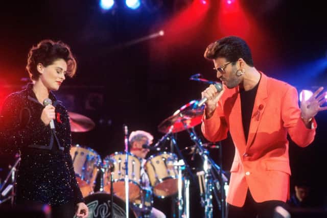 Lisa Stansfield and George Michael perform on stage in 1992. Picture: Getty