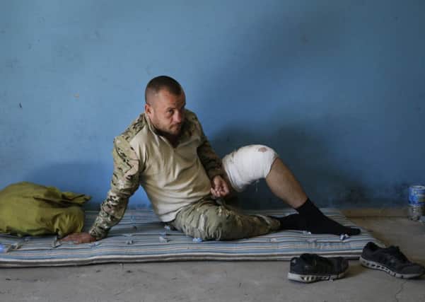 A wounded Ukrainian soldier in the border town of Novoazovsk, which was captured by pro-Russian forces following heavy shelling on Wednesday. Picture: Sergei Grits/AP