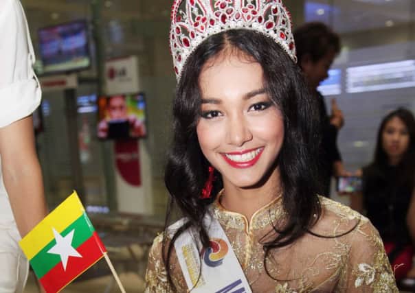 May Myat Noe with her countrys flag and the nowmissing £60,000 pageant crown. Picture: AP