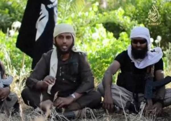 A recruitment video by Islamic State militants - the one on the right was identified as being from Aberdeen. Picture: Complimentary