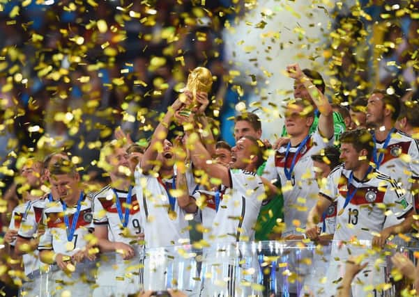 Germany celebrate with the World Cup trophy  after defeating Argentina 1-0 in extra time. Picture: Getty