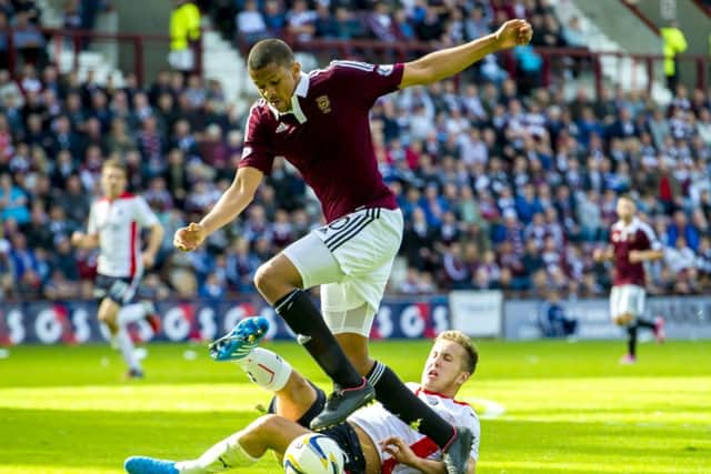 Osman Sow (top) is brought down in the box by Falkirk's Will Vaulks. Picture: SNS