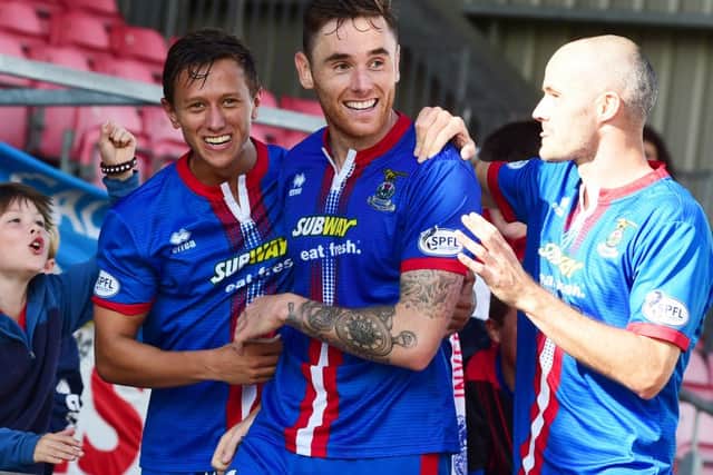 Greg Tansey (centre) celebrates his goal with team-mates Danny Williams (left) and David Raven. Picture: SNS