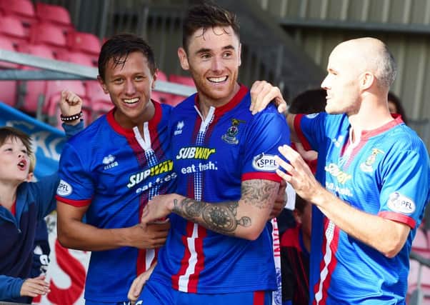Greg Tansey (centre) celebrates his goal with team-mates Danny Williams (left) and David Raven. Picture: SNS
