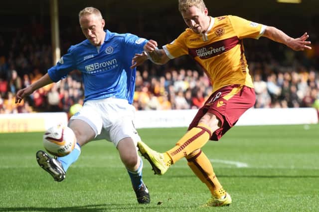 Motherwell's Josh Law (right) battles with St Johnstone's Steven Anderson. Picture: SNS